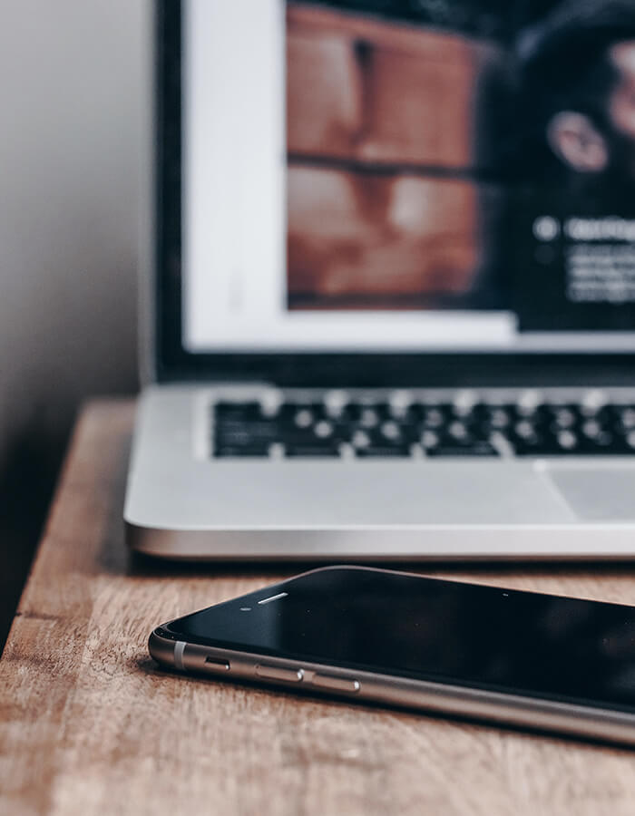 Laptop and smartphone on a desk